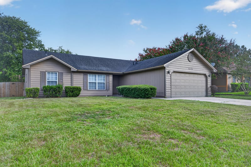 Front exterior view of home and landscaping at 6646 Shiloh Creek Dr