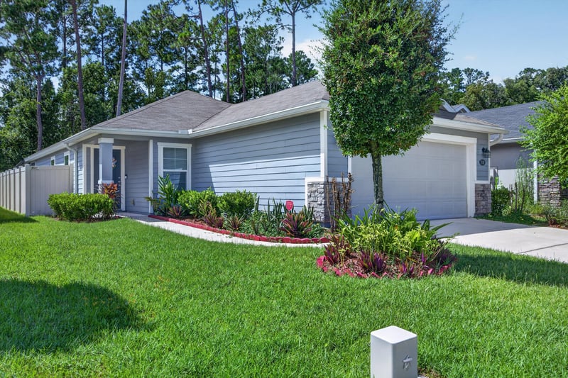 Front exterior garage and landscaping at 7118 Preston Pnes Trl, Jacksonville, FL