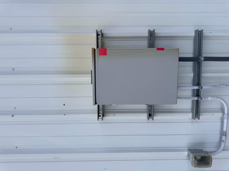 Electrical panel mounted on wall track at 11700 New Kings Rd, Jacksonville, FL 32219