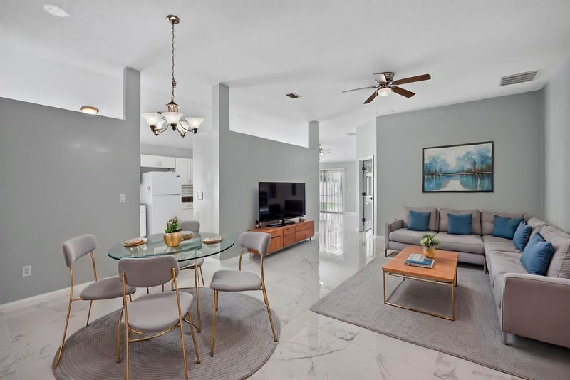 Staged living and dining area with tile flooring at 490 Hillside Dr, Orange Park, FL 32073