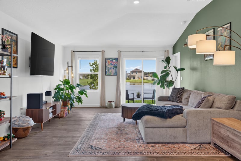 Living room with sliding glass doors at 4276 Quaking St, Jacksonville, FL 32218