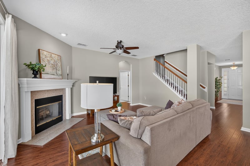 Living room with fireplace near the staircase at 3660 Middlebrook Dr, Orange Park, FL 32065