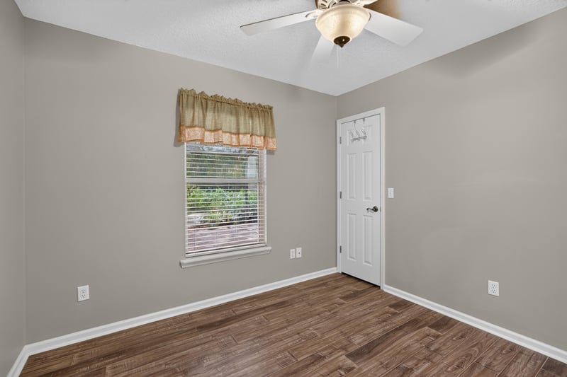 Empty bedroom with closet door at 1955 GUARDED Way, Fleming Island, FL 32003