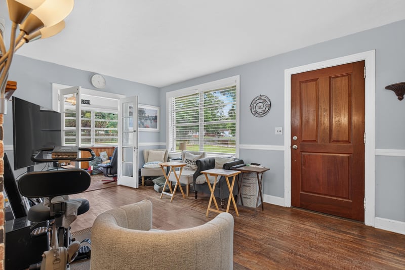 Living room with workspace and entry door at 5745 110th St, Jacksonville, FL 32244