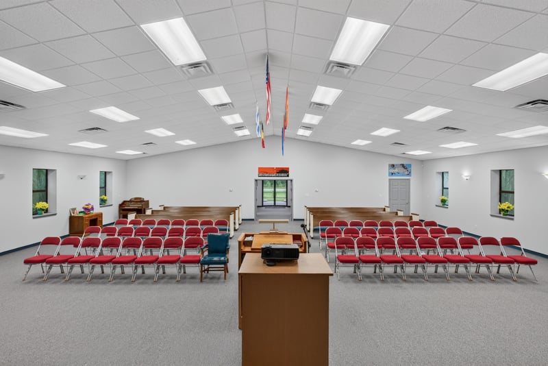 Assembly hall with red folding chairs and tables at 1038 County Rd 315, Melrose