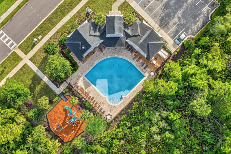 Aerial view of community pool and playground in Andalusia