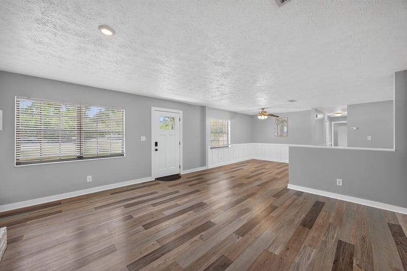 Living area with wood floors and French door entry at 6757 Deer Springs Rd, Keystone Heights, FL 32656