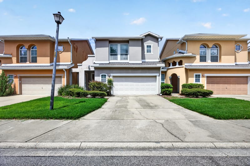 Front exterior with driveway and entry at 6217 Eclipse Cir, Jacksonville, FL 32258