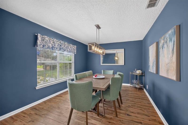 Dining room with round table and blue walls at 12825 Kelsey Island Dr, Jacksonville, FL 32224