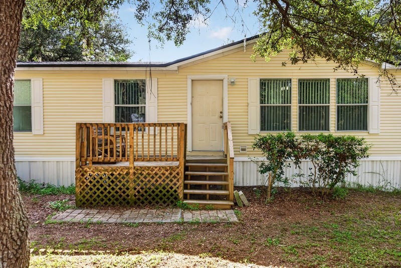 Front entry with wood deck and stairs at 3215 Robin Ln, Middleburg, FL