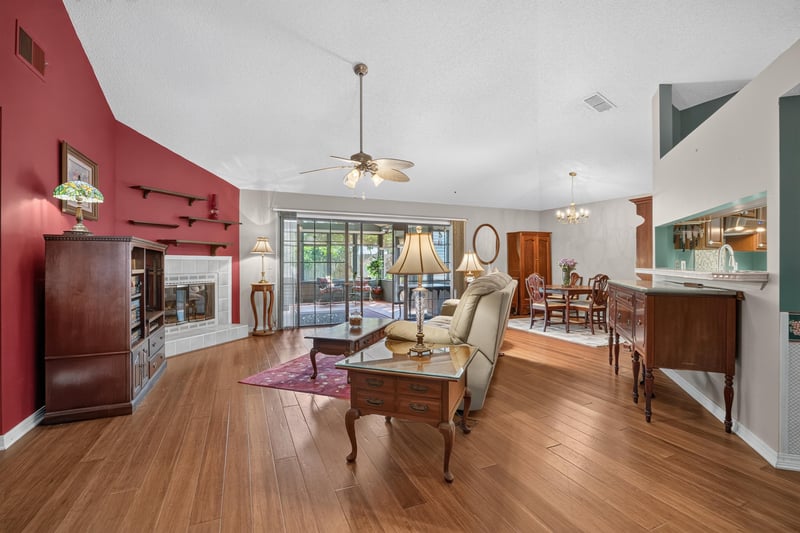Living room with vaulted ceiling and fireplace at 4837 Pareja Ct, Jacksonville, FL 32225