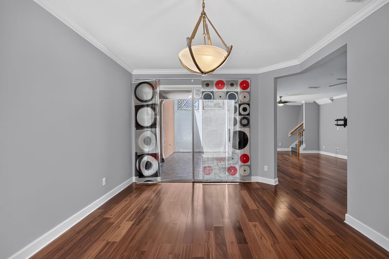 Entry area with wood floors leading to living space at 6217 Eclipse Cir, Jacksonville, FL 32258