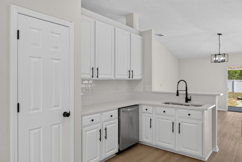 Kitchen corner with white cabinets and sink at 224 Pine Arbor Cir, St. Augustine, FL 32084