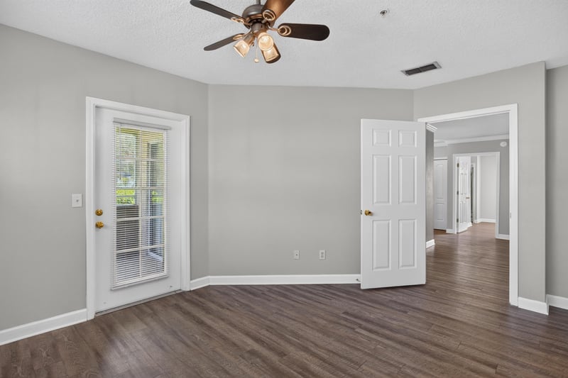 Room with French doors and hardwood floors at 1701 The Greens Way 1415, Jacksonville Beach, FL 32250