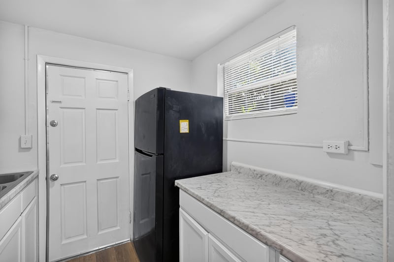 Kitchen refrigerator and granite counter at 4951 Halls Dr