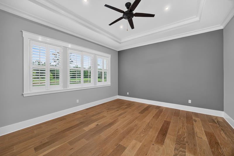Empty room with ceiling fan and windows at 186 Freshwater Dr