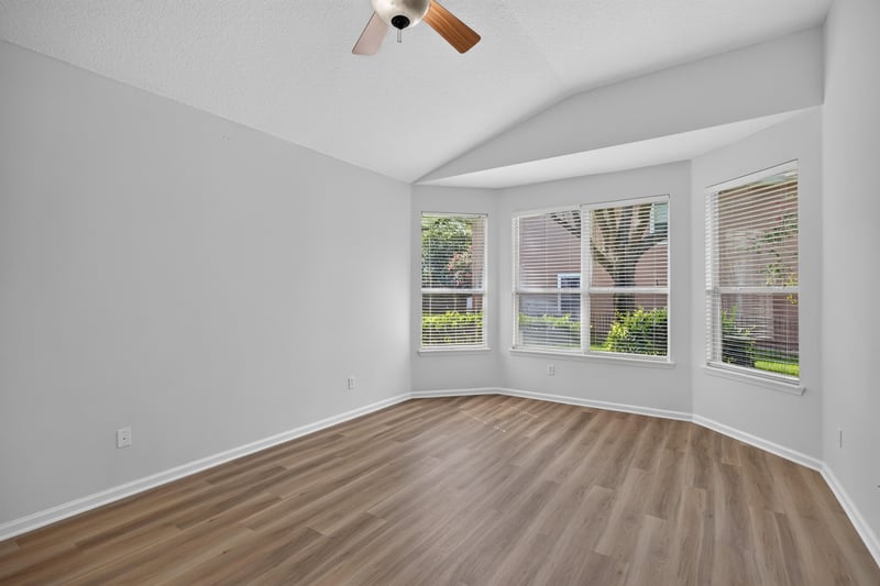Primary bedroom with bay window and wood floor at 3101 E Banister Rd, St. Augustine, FL 32092