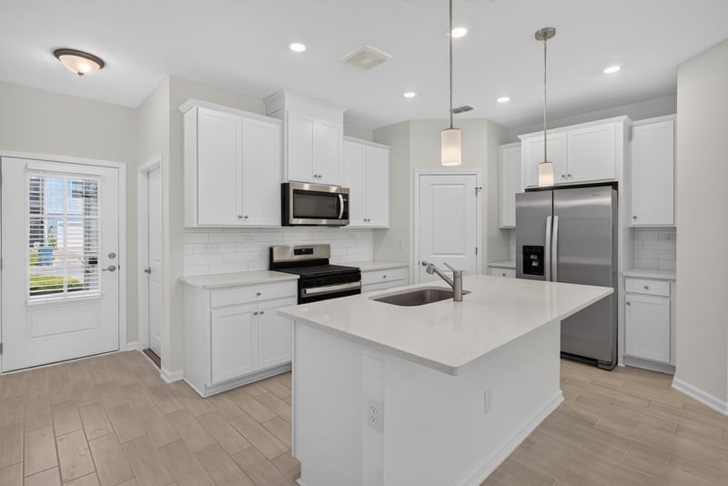 Kitchen island and stainless appliances at 39 Mellowood Ln, St. Augustine, FL 32092