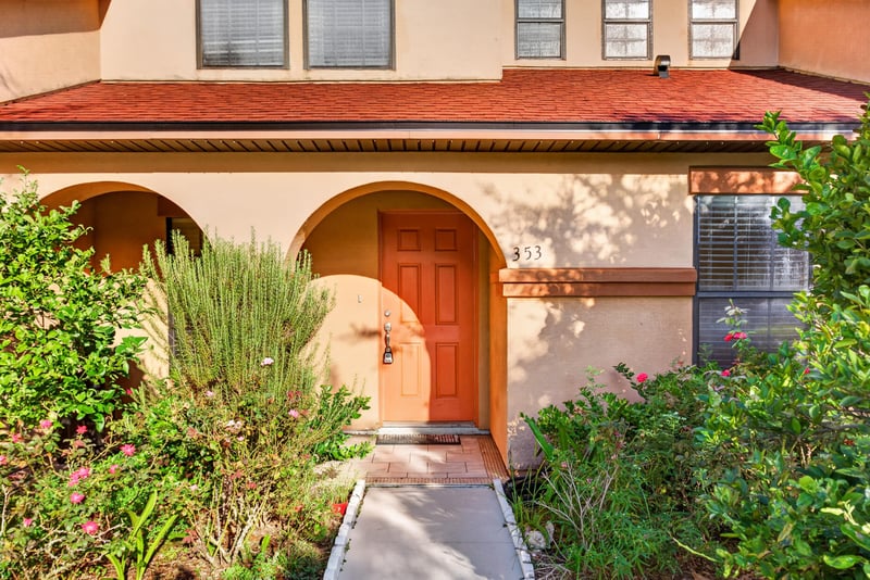 Front entry with arched doorway and landscaping at 353 Redwood Ln