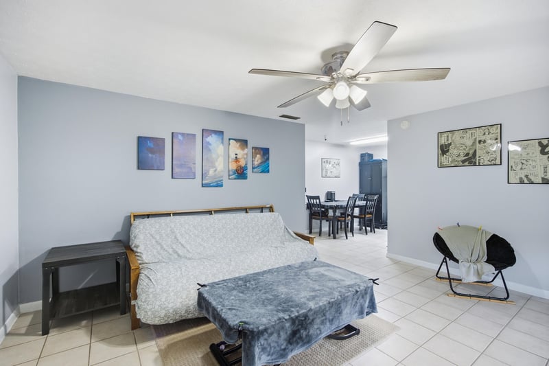 Living room with ceiling fan and wall art at 417 Capricorn Ln, Orange Park, FL 32073