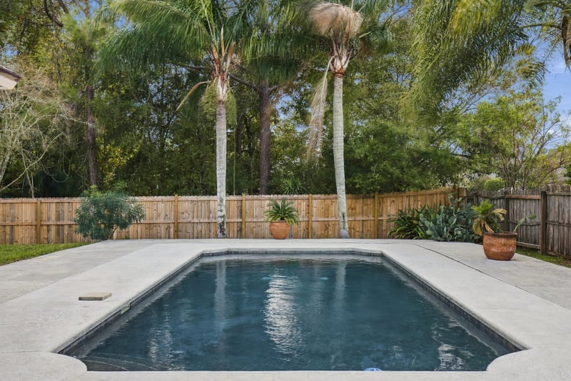 Backyard pool and patio, photographed by Megapixeler on Winding Springs Ct, Jacksonville