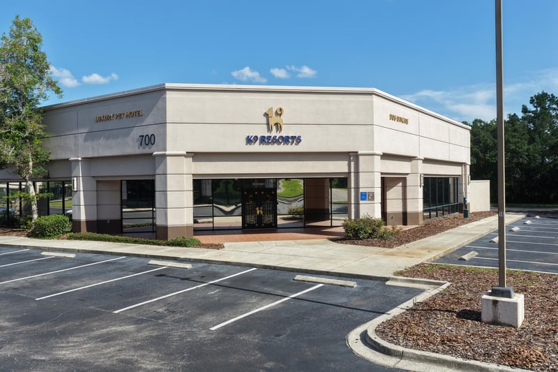 Building front with SIP Resorts signage and awning at 10550 Deerwood Park Blvd, Jacksonville, FL 32256