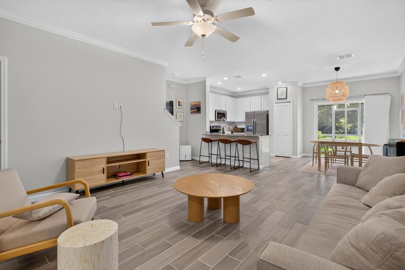 Living room with TV console and dining area at 1186 Beach Dune Dr, Jacksonville, FL 32233