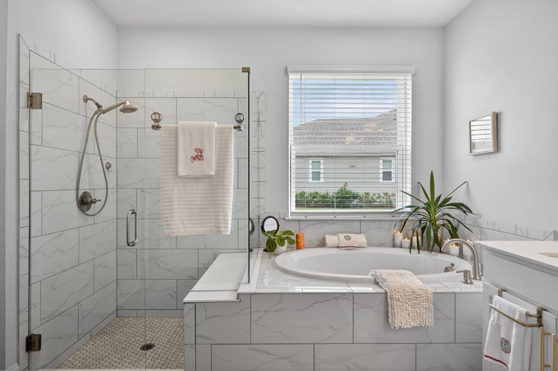 Primary bathroom with glass shower and soaking tub at 85491 Fall River Pkwy, Fernandina Beach, FL 32034