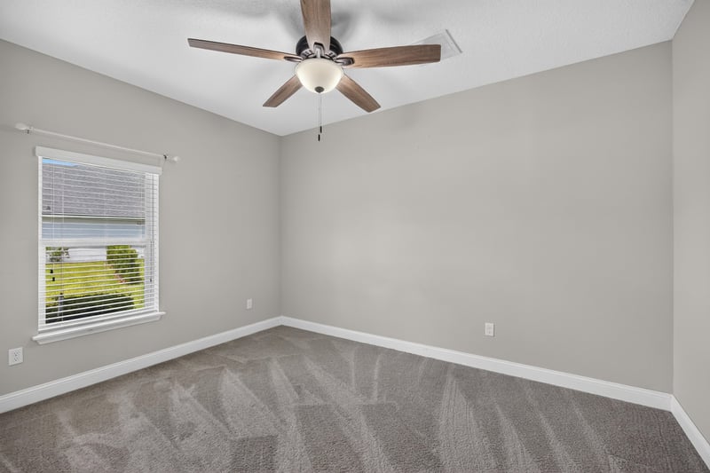 Carpeted bedroom with window at 53 Lumen Ct, St. Augustine, FL 32095