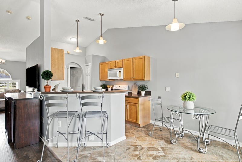 Kitchen with wood cabinets and breakfast bar at 11197 Illford Dr