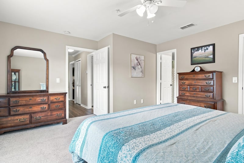 Bedroom with dresser and mirror at 7800 Point Meadows Dr, Jacksonville, FL 32256