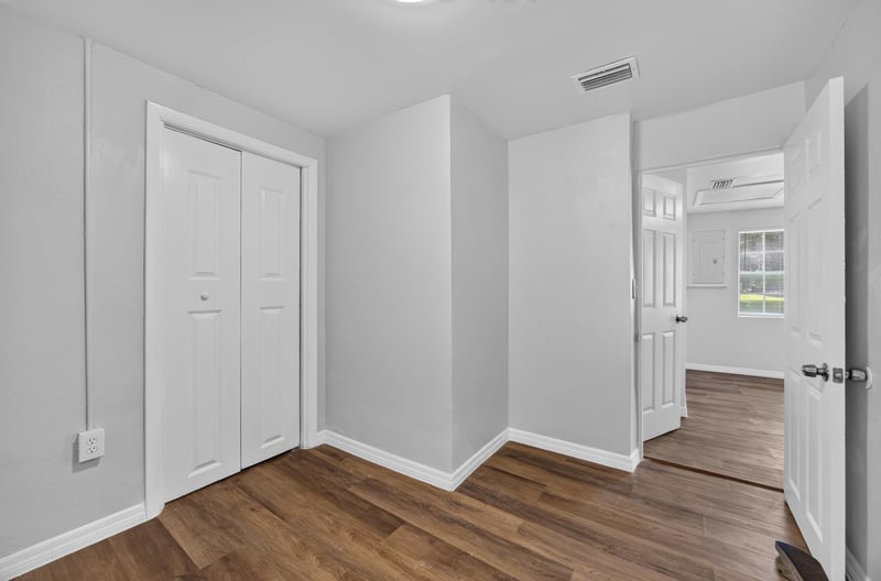 Bedroom with closet doors and hallway view at 4951 Halls Dr