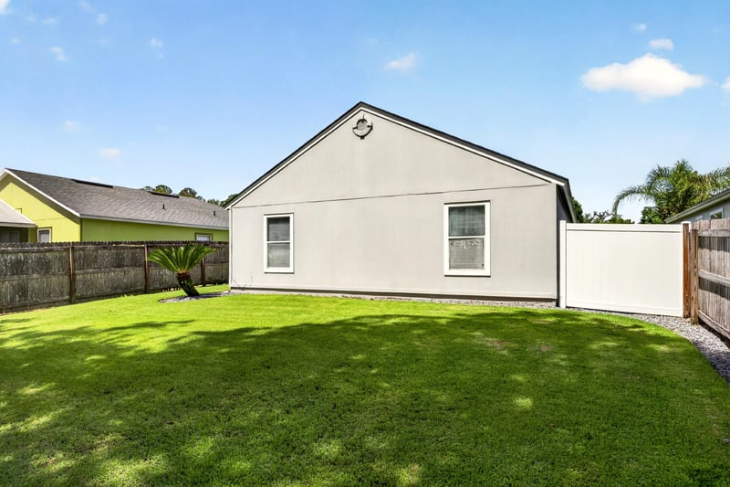 Side exterior wall with fenced yard at 3067 Wavering Ln, Middleburg, FL 32068