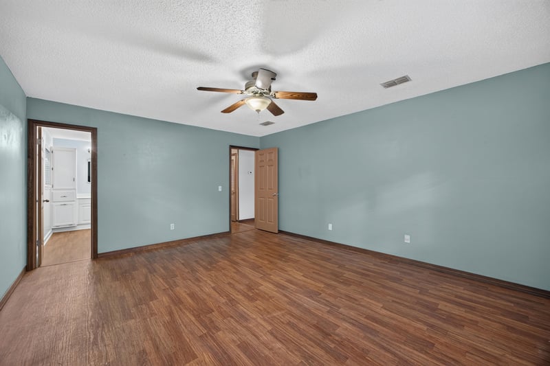 Bedroom with light blue walls and ceiling fan at 892 Branscomb Rd, Green Cove Springs, FL