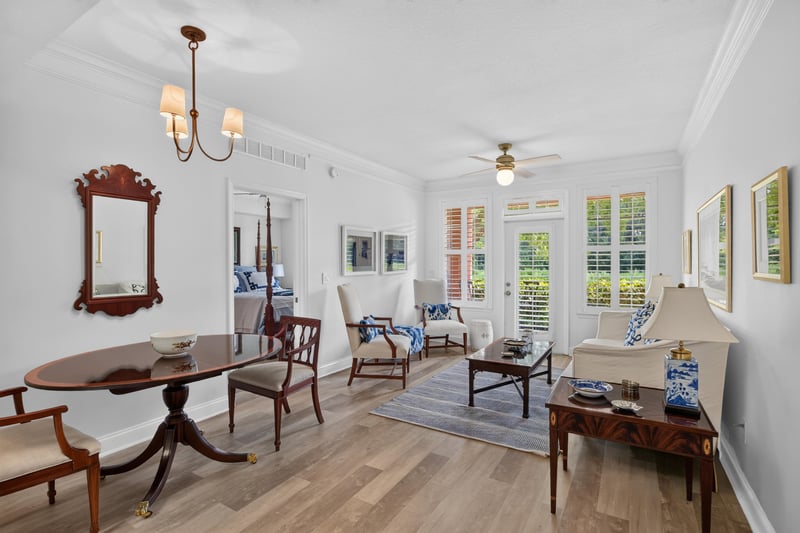 Dining table set beneath a wood-framed mirror at 10435 Mid Town Pkwy unit 135, Jacksonville, FL 32246