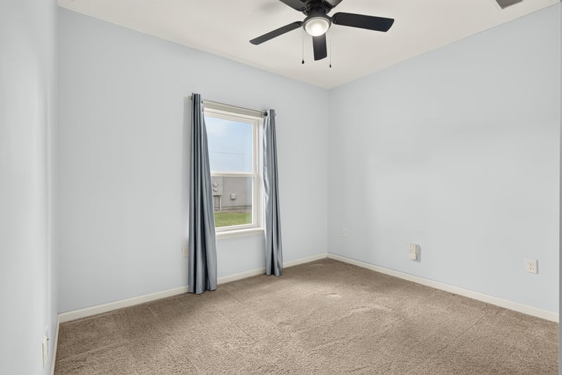 Carpeted room with curtained window at 2378 Caney Oaks Dr, Jacksonville, FL