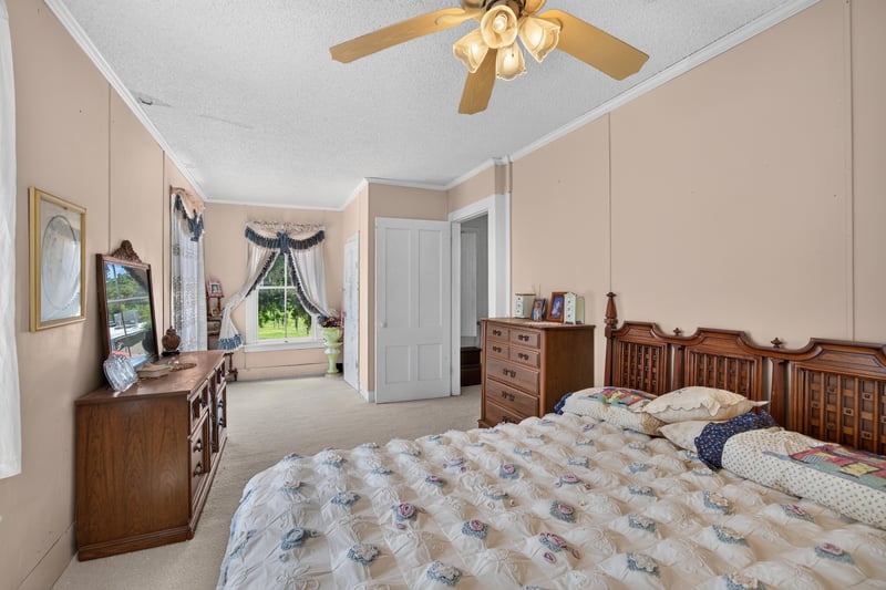 Bedroom with matching dressers and bed at 1173 US-17, Satsuma, FL 32189