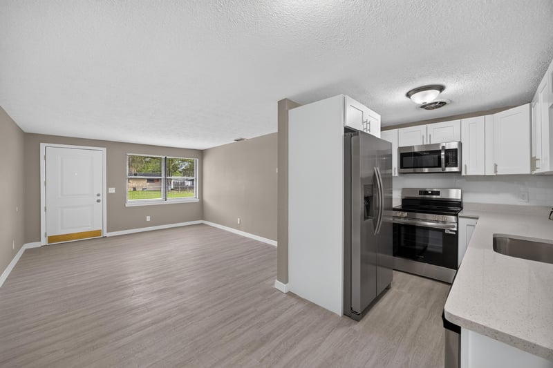 Kitchen and dining area with wood-look flooring at 184 Draco St, Orange Park, FL 32073