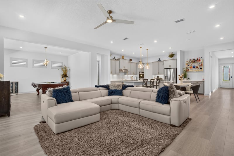 Living room open to the kitchen beyond at 785 Back Creek Dr, St. Augustine, FL 32092