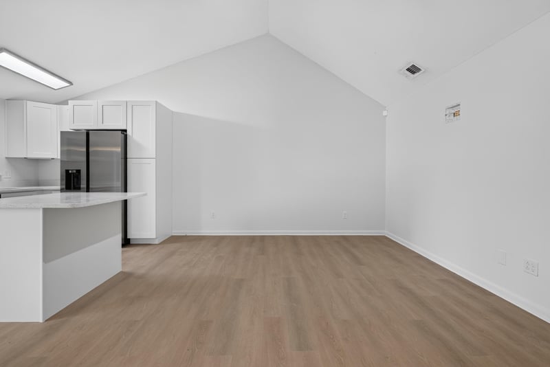 Kitchen island under vaulted ceiling, unfurnished at 8177 Virgo St, Jacksonville, FL 32216