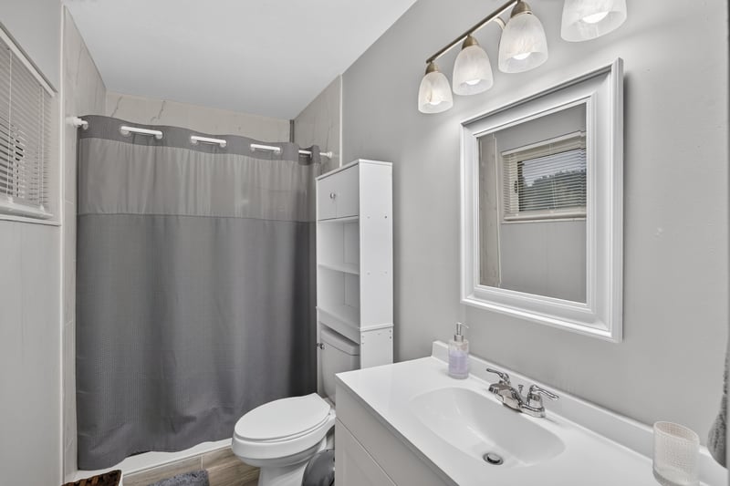 Bathroom with tub-shower combo and vanity at 9506 Harriet Ave, Jacksonville, FL 32208