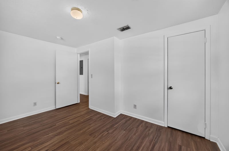 Empty bedroom with closet doors at 5812 Tampico Rd, Jacksonville, FL 32244