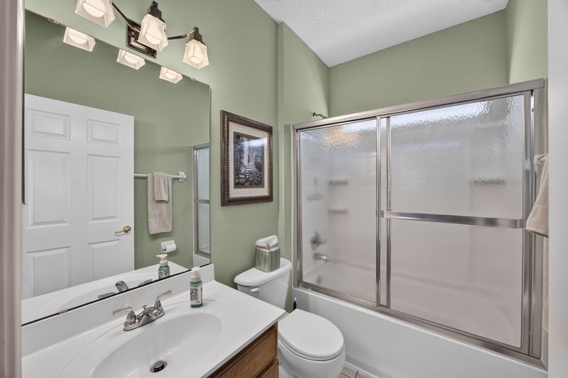 Bathroom with glass-enclosed shower at 3660 Middlebrook Dr, Orange Park, FL 32065