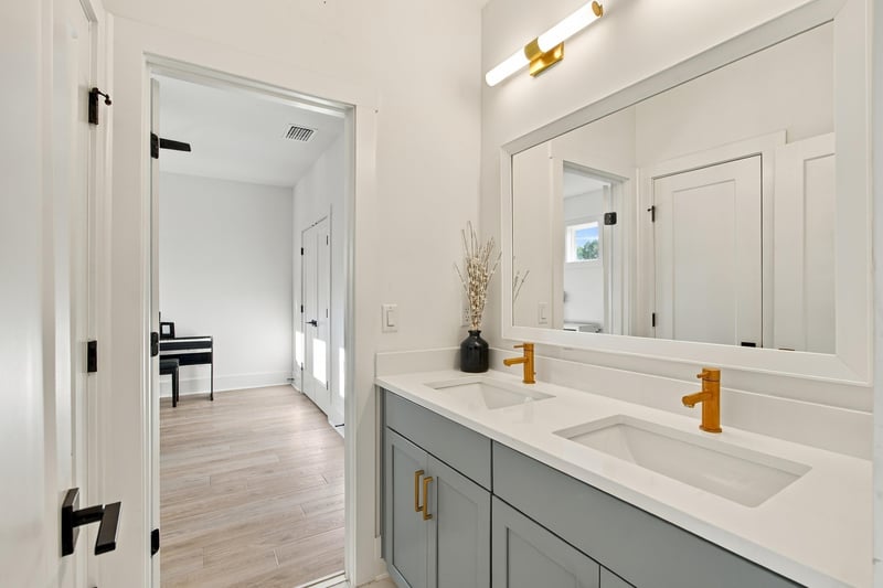 Bathroom vanity with mirror and sconces at 907 Seagrove Dr, Ponte Vedra Beach, FL 32081