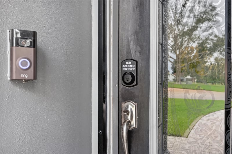 Front door lock with view to the yard at 6931 Cane Grass Ln E, Jacksonville, FL 32244