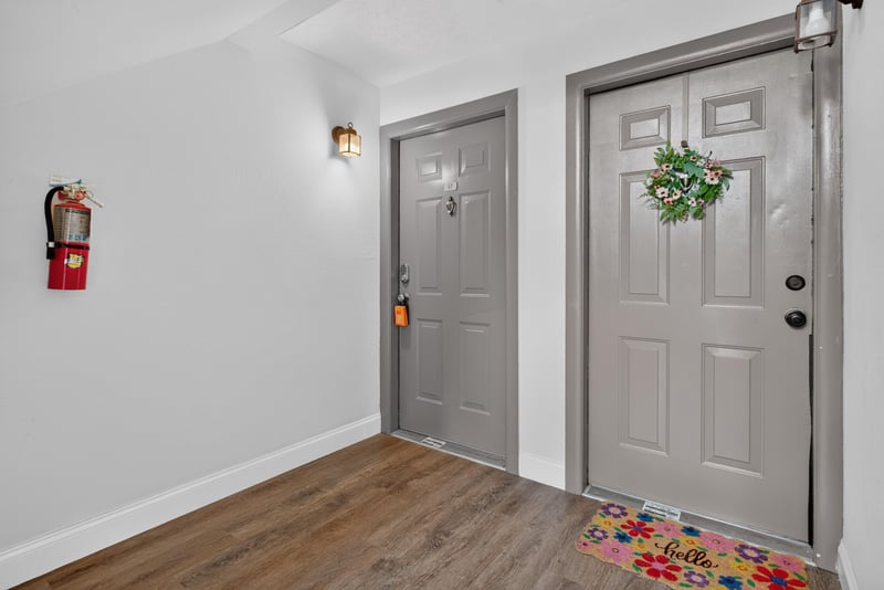 Entry hallway with two gray doors at 5811 Atlantic Blvd unit 47, Jacksonville, FL 32207