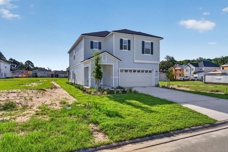 Front exterior with newly planted tree and lawn at 269 Bluegrass Wy, St. Augustine, FL 32092