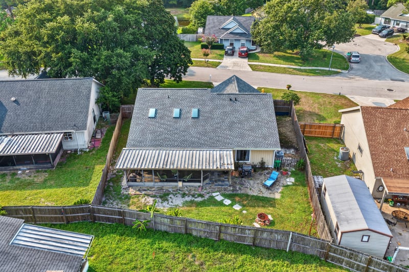 Aerial backyard view with patio awning at 13020 Medford Ln, Jacksonville, FL 32225