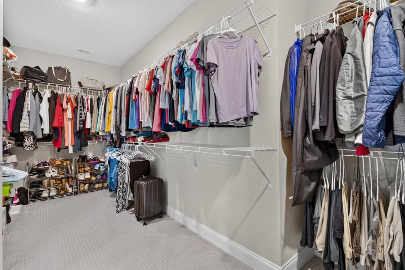 Primary closet with built-in shelving at 22 Azura Point