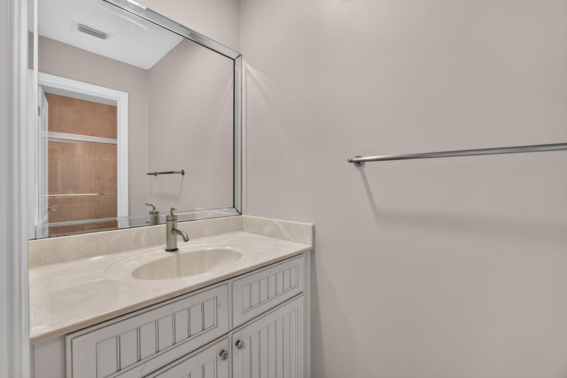 Bathroom vanity with mirror at 117 Island Cottage Way, St. Augustine, FL 32080